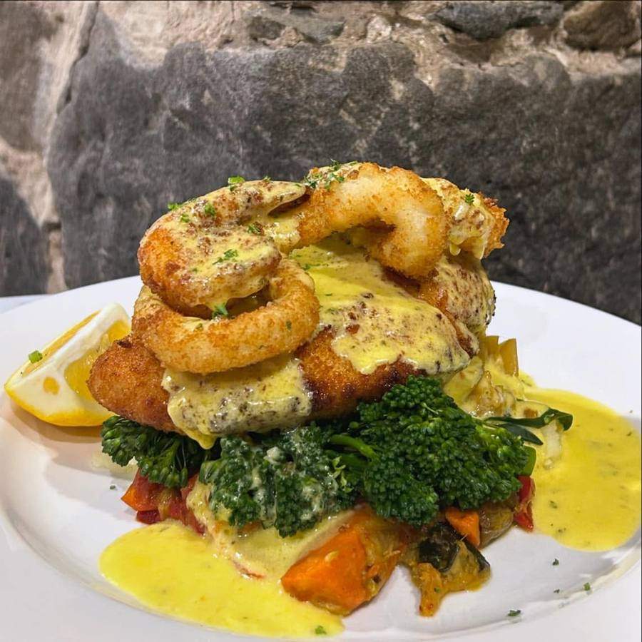 Seafood chicken with broccolini and roast vegetables.