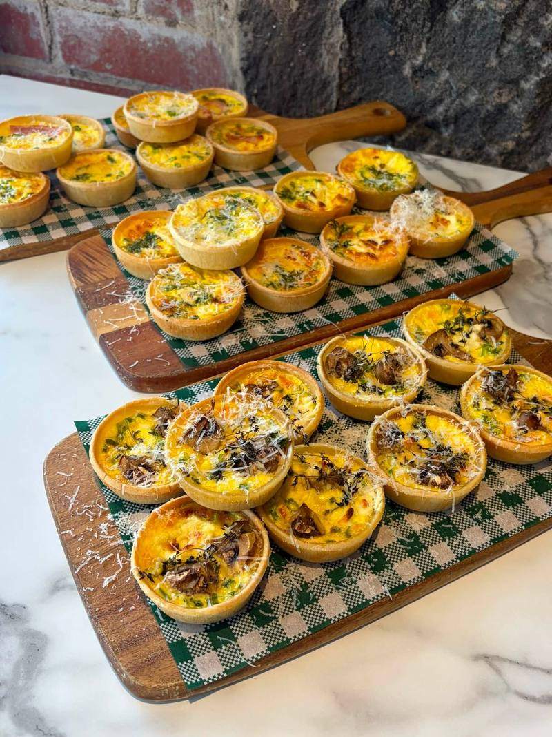 Trays of small quiches.